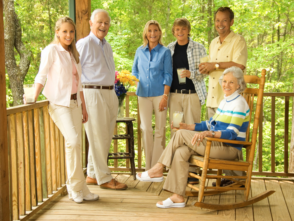 Photo of a family on the front porch of their cottage