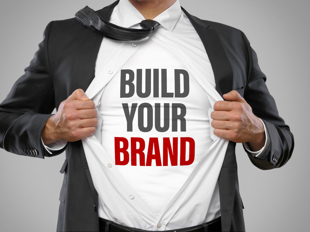 Man with T-shirt that says "build your brand"
