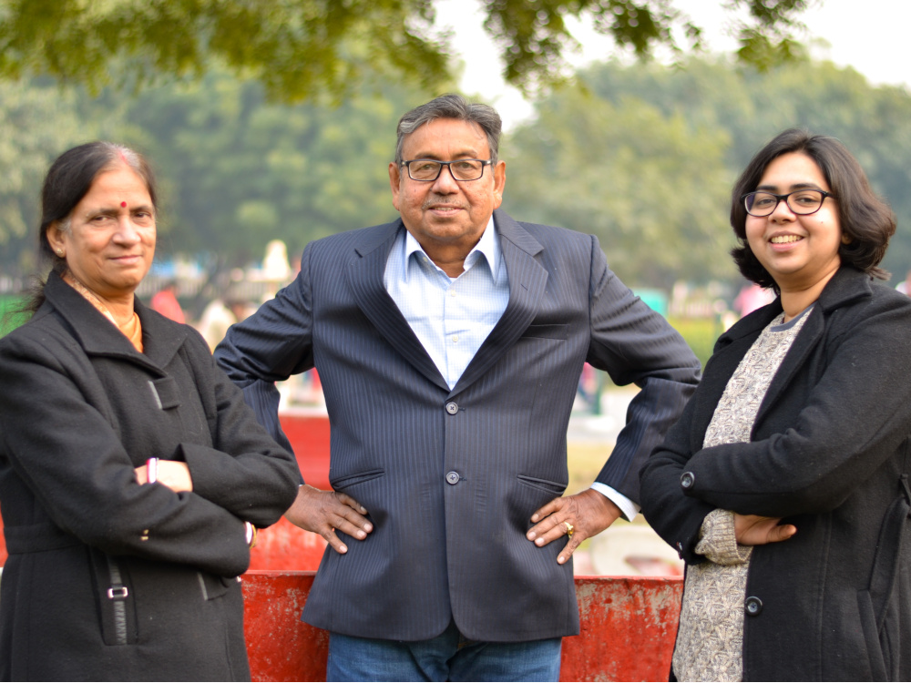 Photo of businessman with his wife and daughter