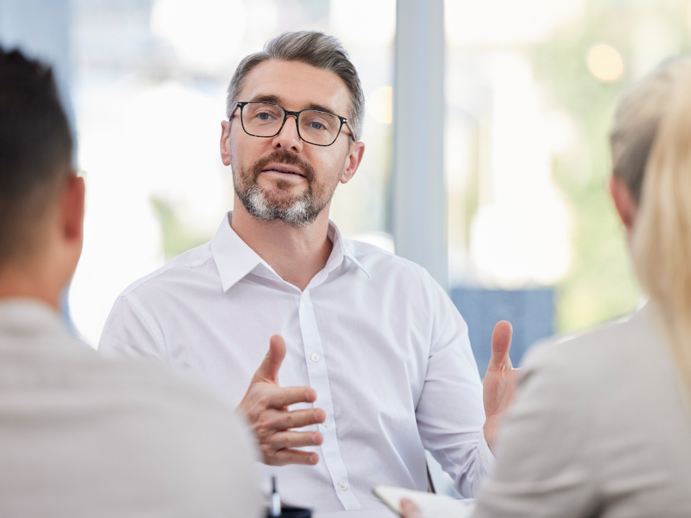 Picture of man being interviewed in an office
