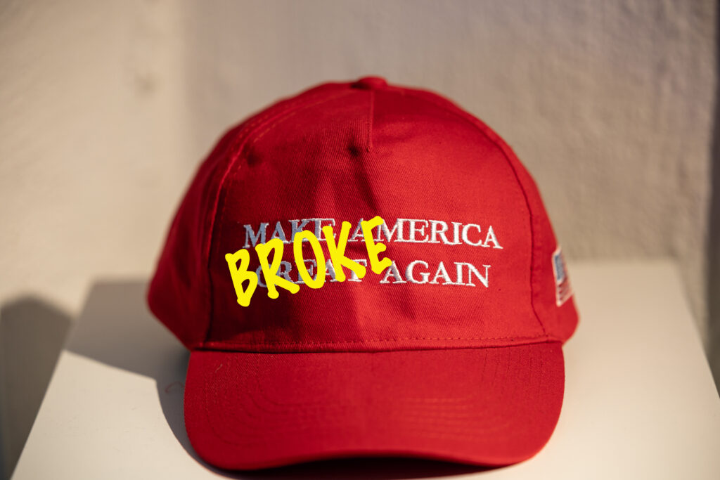 A photo illustration of a MAGA hat with the word "broke" over great, referring to the fiscal impact of the One Big Beautiful Bill Act