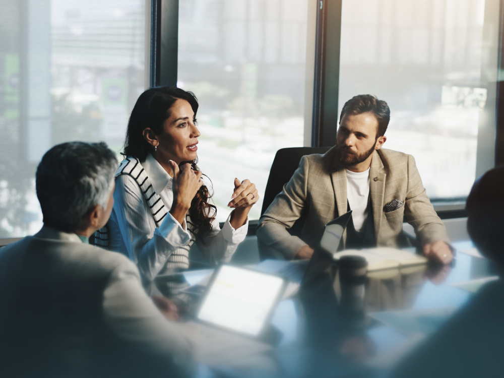 Image of family business people around a table.