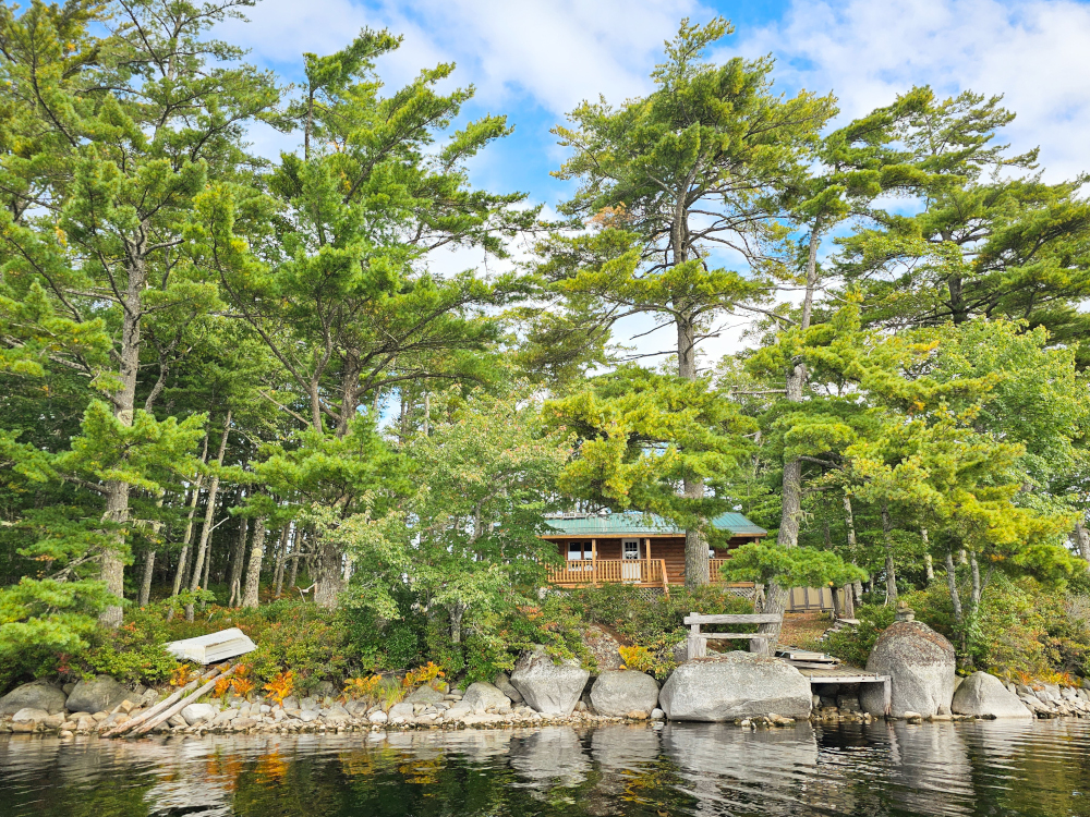Photo of Back Lake Island with a house on it, in Nova Scotia.