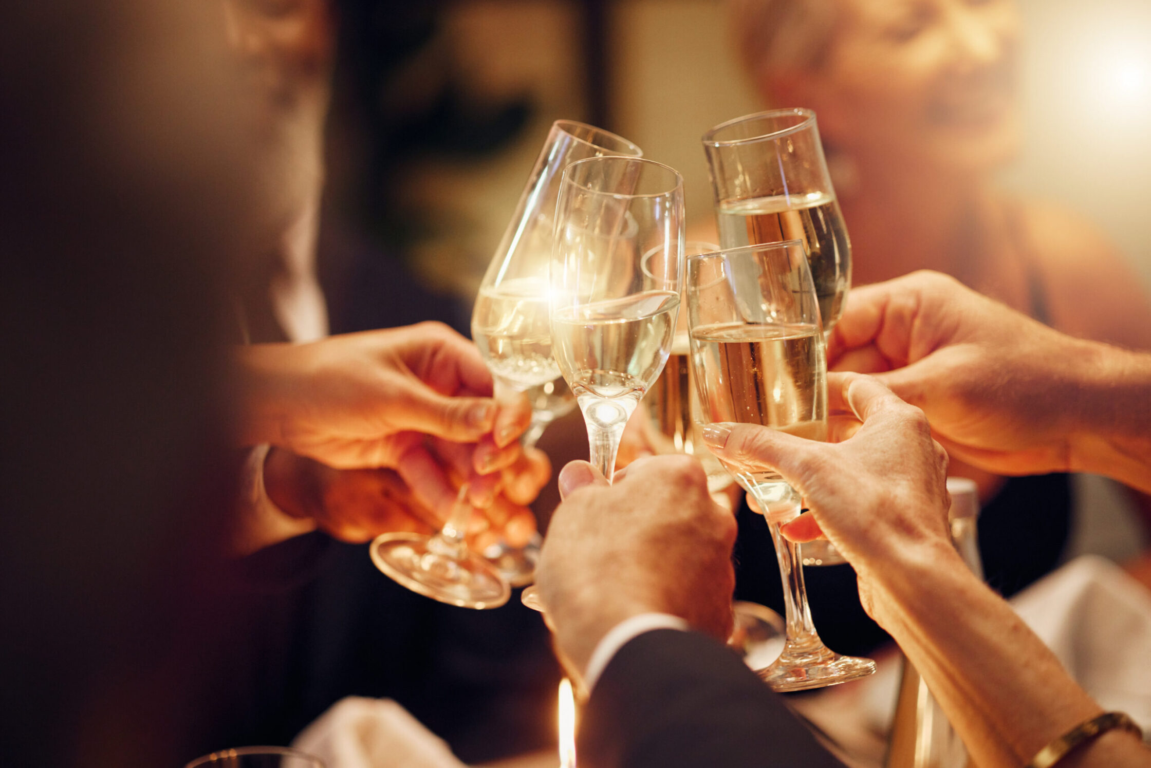 Photo of people toasting with champagne. Master Sommelier John Szabo highlights sparkling wines that are sure to please over the holidays.