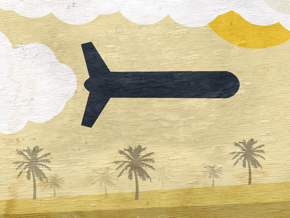 Image of a military drone flying above a desert with palm trees.