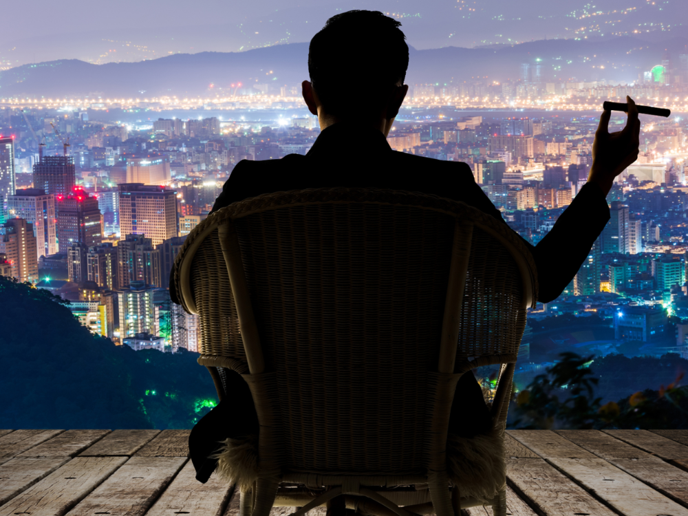 Man sitting smoking a cigar