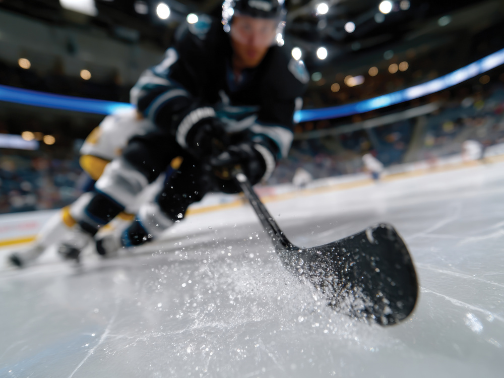 Photo of hockey player taking a shot.