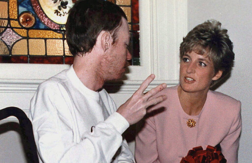 Photo of Diana, Princess of Wales, chatting with AIDS patient Wayne Taylor at Casey House AIDS hospice in Toronto in this Oct. 26, 1991 photo. It's been almost 30 years since Diana, Princess of Wales, kissed an AIDS patient on the cheek.Her open-hearted, selfless gesture of compassion at London's Mildmay Hospital in 1989 was noticed around the world and helped reduce the vast belief that AIDS could be transferred by human touch. THE CANADIAN PRESS/Hans Deryk