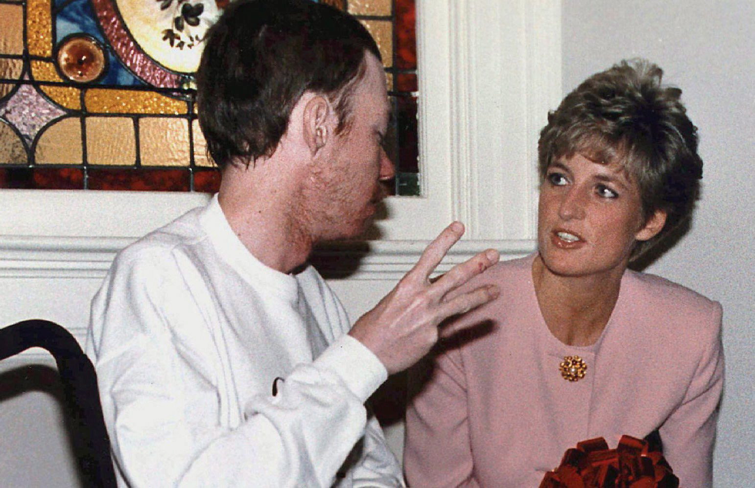 Photo of Diana, Princess of Wales, chatting with AIDS patient Wayne Taylor at Casey House AIDS hospice in Toronto in this Oct. 26, 1991 photo. It's been almost 30 years since Diana, Princess of Wales, kissed an AIDS patient on the cheek.Her open-hearted, selfless gesture of compassion at London's Mildmay Hospital in 1989 was noticed around the world and helped reduce the vast belief that AIDS could be transferred by human touch. THE CANADIAN PRESS/Hans Deryk