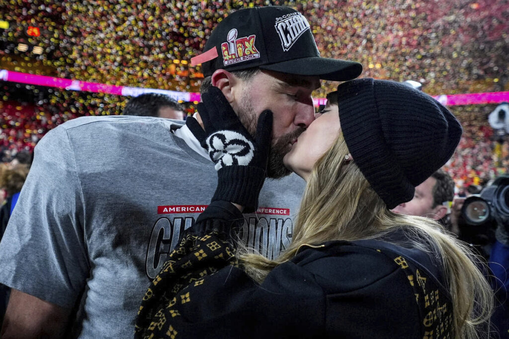 Photo of Travis Kelce and Taylor Swift, a high-profile example of a couple where the woman earns more than the man, as discussed in this commentary about income imbalance and the challenges that can arise when a woman earns more than a man.